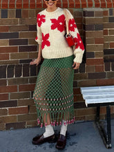 Suéter floral de cuello redondo que combina con todo